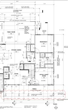 Architectural floor plan showing residential layout with multiple rooms, dimensions, and construction details